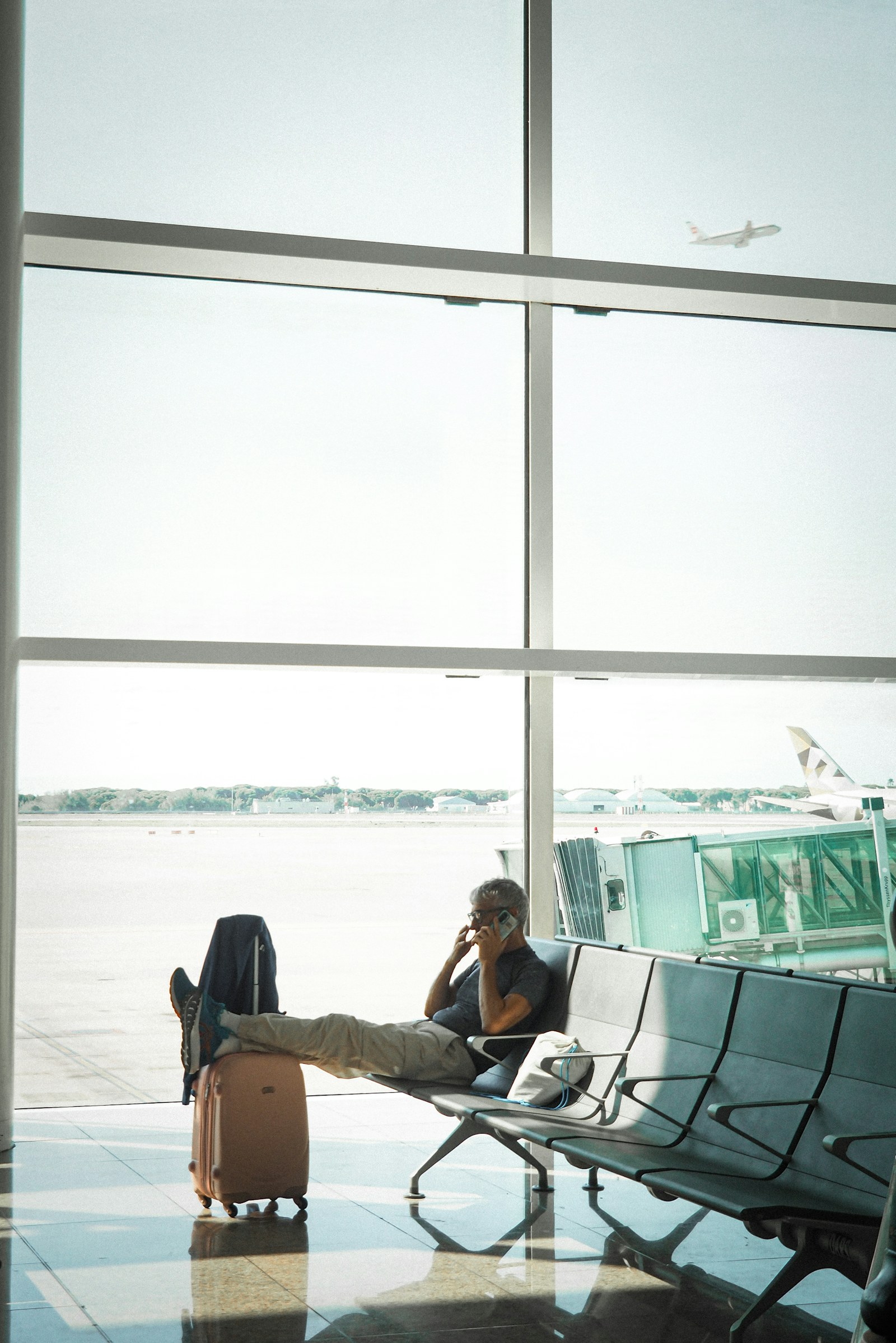 Traveler waiting at an airport after a flight or itinerary change