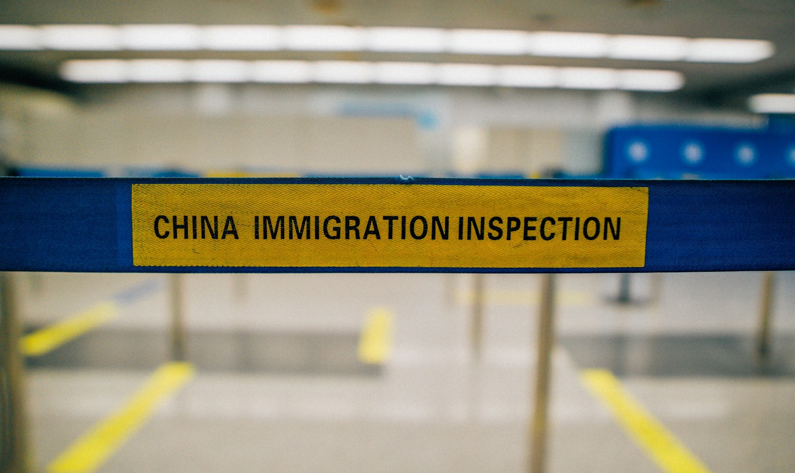 China Immigration Inspection sign at an arrival checkpoint